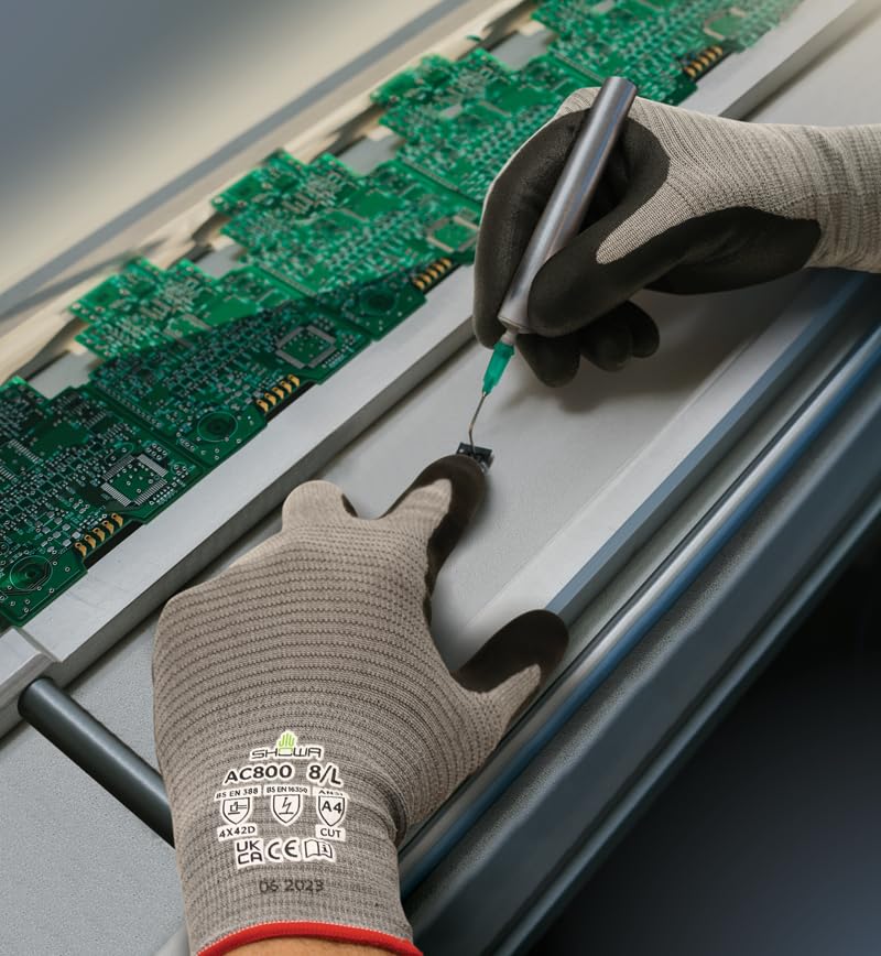 Worker wearing Showa® AC800 Anti-Static A4 Nitrile Coated Knitted Gloves handling a computer chip